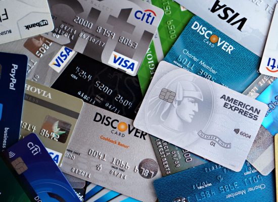 A flat lay of assorted credit and debit cards from various banks. Ideal for finance and banking concepts.